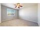 Bright bedroom with large windows and ceiling fan at 16047 E Geddes Ln # 128, Aurora, CO 80016