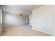 Large bonus room with neutral paint and carpet ready for your personal design at 16047 E Geddes Ln # 128, Aurora, CO 80016