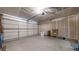 Spacious two-car garage with ample room for vehicles, storage, and potential workshop area at 16047 E Geddes Ln # 128, Aurora, CO 80016