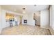 Spacious living room with open floor plan, fireplace, and barstool seating at the kitchen counter at 16047 E Geddes Ln # 128, Aurora, CO 80016
