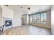 Inviting living room featuring a fireplace, large windows, and an open layout at 16047 E Geddes Ln # 128, Aurora, CO 80016