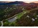 Scenic aerial view capturing a lush landscape with beautiful homes and a serene lake, showcasing a luxurious community at 2548 Keystone Dr, Evergreen, CO 80439