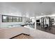 This open basement features a workout area, pool table, and lots of natural light, with great views of the surrounding landscape at 2548 Keystone Dr, Evergreen, CO 80439