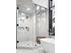 Modern bathroom featuring a glass enclosed shower, soaking tub, and contemporary finishes at 2548 Keystone Dr, Evergreen, CO 80439