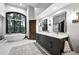 Luxurious bathroom with a standalone soaking tub, double vanity, and modern fixtures at 2548 Keystone Dr, Evergreen, CO 80439