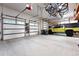 Spacious garage features ample storage and an epoxy floor at 2548 Keystone Dr, Evergreen, CO 80439
