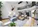 Inviting living room with vaulted ceilings, a fireplace, and abundant natural light at 2548 Keystone Dr, Evergreen, CO 80439