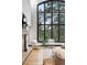 Bright living room boasting floor-to-ceiling windows with scenic views of the surrounding landscape at 2548 Keystone Dr, Evergreen, CO 80439