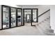 Finished basement rec room featuring stairs, billiards, and a workout area at 2548 Keystone Dr, Evergreen, CO 80439