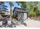 Well kept backyard featuring a modern shed, and patio area under mature shade trees at 7633 S Gilpin Ct, Centennial, CO 80122