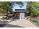 Landscaped backyard with shed, patio area, modern furniture and lush greenery at 7633 S Gilpin Ct, Centennial, CO 80122