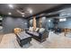 Finished basement with dark walls, stylish furnishings, and a recreation area at 7633 S Gilpin Ct, Centennial, CO 80122