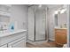 Bright bathroom featuring a corner shower with glass doors and a classic vanity at 7633 S Gilpin Ct, Centennial, CO 80122