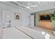 Bedroom with built-in storage, modern lighting, and a view into the bathroom at 7633 S Gilpin Ct, Centennial, CO 80122