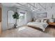Bright bedroom featuring a ceiling fan, large window, and a comfortable bed at 7633 S Gilpin Ct, Centennial, CO 80122