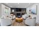 Beautiful living room with a fireplace, TV, and stylish seating arrangement on a patterned rug at 7633 S Gilpin Ct, Centennial, CO 80122
