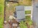 Aerial view of home with a backyard stone patio, wood deck and mature trees at 4623 S Kalispell Way, Aurora, CO 80015