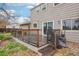 Back deck with railing and small steps at 4623 S Kalispell Way, Aurora, CO 80015