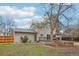 Spacious backyard with deck, lawn, landscaping and mature trees at 4623 S Kalispell Way, Aurora, CO 80015