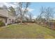 Large backyard with a wooden deck and a wood fence that borders a park at 4623 S Kalispell Way, Aurora, CO 80015