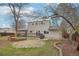 Fenced backyard featuring a deck, stone patio, and manicured lawn at 4623 S Kalispell Way, Aurora, CO 80015
