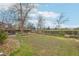 Expansive backyard with stone edging and a wood fence that borders a large open area at 4623 S Kalispell Way, Aurora, CO 80015