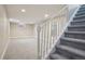 Finished basement with neutral carpet and white trim and stairs at 4623 S Kalispell Way, Aurora, CO 80015