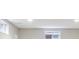 Finished basement with neutral carpet and two windows at 4623 S Kalispell Way, Aurora, CO 80015