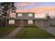 Charming two-story home with brick and siding and a well-manicured lawn at 4623 S Kalispell Way, Aurora, CO 80015