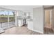 Modern kitchen with sleek countertops, and stainless steel appliances with sliding doors to outside at 4623 S Kalispell Way, Aurora, CO 80015