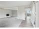 Bright and airy living room featuring a cozy fireplace and neutral decor at 4623 S Kalispell Way, Aurora, CO 80015