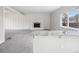 Bright living room with fireplace, new carpet and kitchen bar at 4623 S Kalispell Way, Aurora, CO 80015