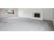 Spacious living room with a fireplace and new carpet at 4623 S Kalispell Way, Aurora, CO 80015