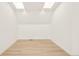 Bright, open attic space featuring skylights and wood floors, ideal for storage or conversion into living space at 263 S Jackson St, Denver, CO 80209