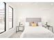 Bright bedroom with a large window, neutral decor, and modern bedside tables at 263 S Jackson St, Denver, CO 80209