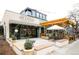Charming floral boutique with a black-and-white striped awning, decorated entrance, and outdoor seating area at 263 S Jackson St, Denver, CO 80209