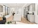 Modern kitchen with stainless steel appliances, an island, and an open layout at 263 S Jackson St, Denver, CO 80209