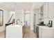 Modern kitchen with stainless steel appliances, an island, and an open layout at 263 S Jackson St, Denver, CO 80209