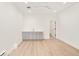 Spacious room with sink, cabinets, hardwood floors, and ample lighting at 263 S Jackson St, Denver, CO 80209