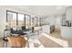 Bright living room features modern decor, large windows, and an open floor plan at 263 S Jackson St, Denver, CO 80209