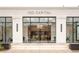 Modern office building entrance featuring floor-to-ceiling windows and clean, minimalist design at 263 S Jackson St, Denver, CO 80209