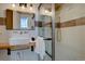 Stylish bathroom with a unique wood countertop sink, a glass-enclosed shower, and modern fixtures at 31932 Steven Way, Conifer, CO 80433