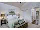 Bedroom with walk-in closet, features stylish decor, and bright light fixtures at 31932 Steven Way, Conifer, CO 80433