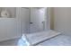 Bright bedroom features a comfortable bed, soft natural lighting, and a small closet at 31932 Steven Way, Conifer, CO 80433