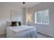 Bright bedroom features a comfortable bed, soft natural lighting, and a picturesque view at 31932 Steven Way, Conifer, CO 80433
