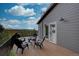 Deck area featuring a seating area overlooking the stunning mountain landscape at 31932 Steven Way, Conifer, CO 80433