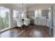 Dining area featuring modern chandelier and scenic views of forest at 31932 Steven Way, Conifer, CO 80433