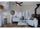Cozy living room with hardwood floors, bright light, and fireplace at 31932 Steven Way, Conifer, CO 80433
