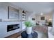 Cozy living room featuring a modern fireplace, tasteful decor, and a comfortable seating area, perfect for relaxation at 31932 Steven Way, Conifer, CO 80433