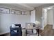 Well-lit office area featuring modern decor, a comfortable chair, and sleek desk, creating an inspiring workspace at 31932 Steven Way, Conifer, CO 80433